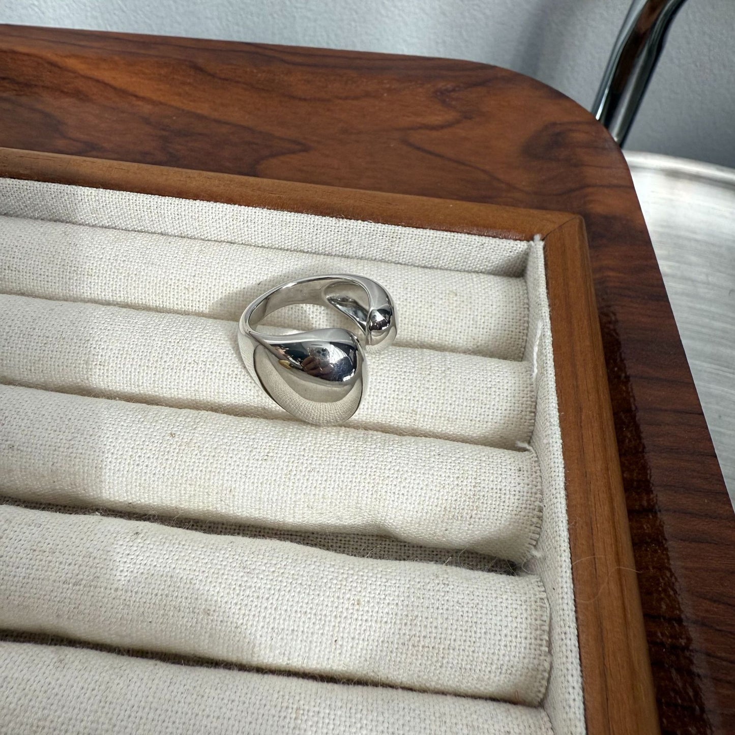 Metallic asymmetrical open ring