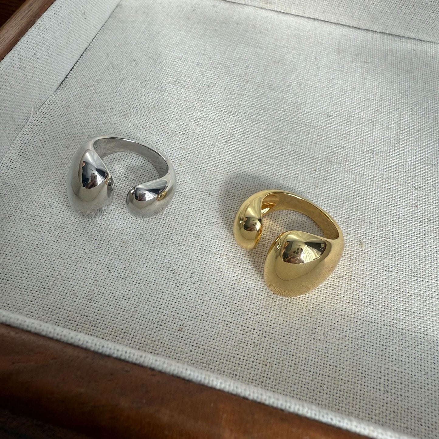 Metallic asymmetrical open ring