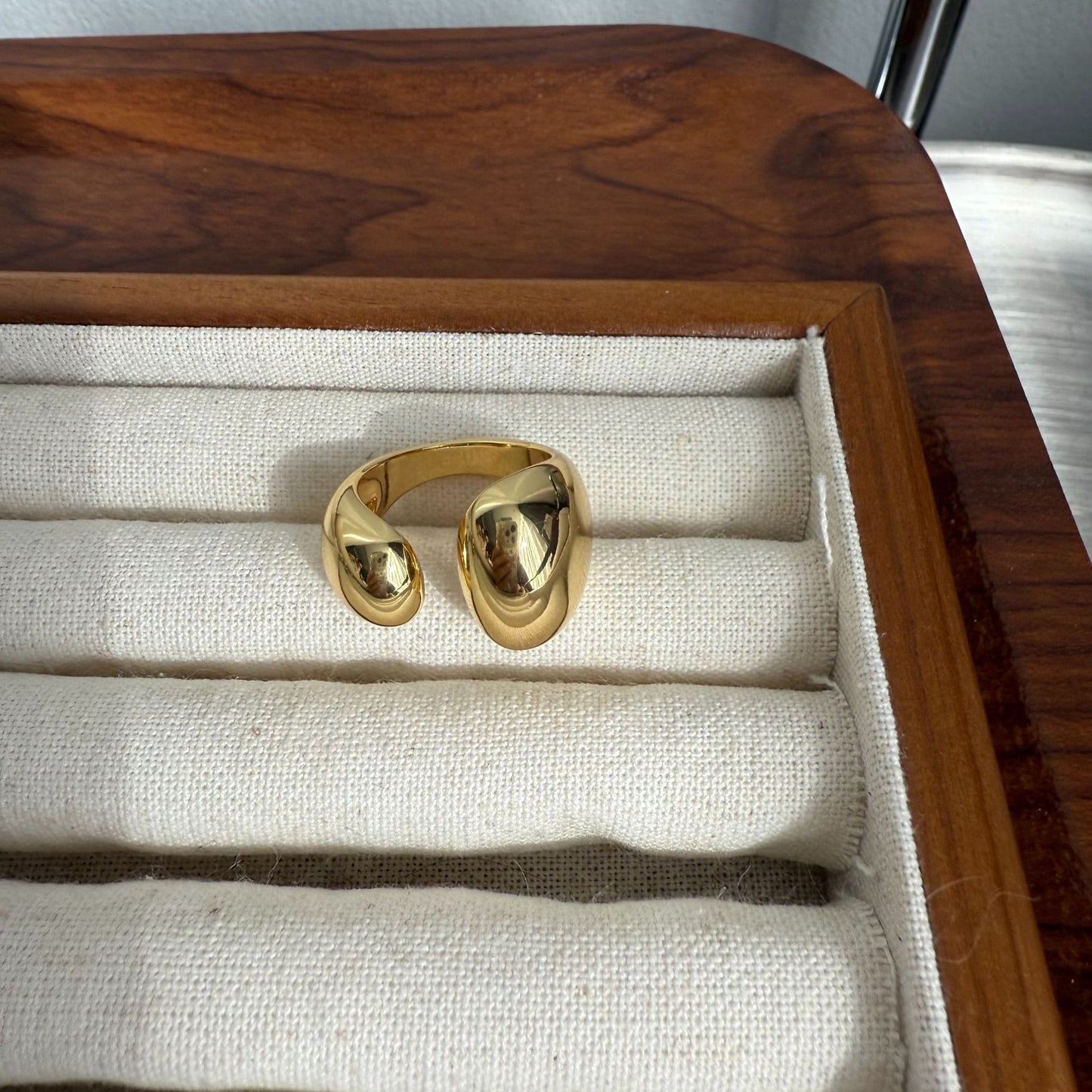 Metallic asymmetrical open ring